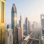 Dubai, UAE - October, 2018. Dubai skyline and downtown skyscrapers on sunset. Modern architecture with highrise buildings on world famous metropolis in United Arab Emirates